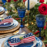 A festive table setting with American flag-themed napkins, blue plates, and red, white, and blue decorations, including roses and candles.